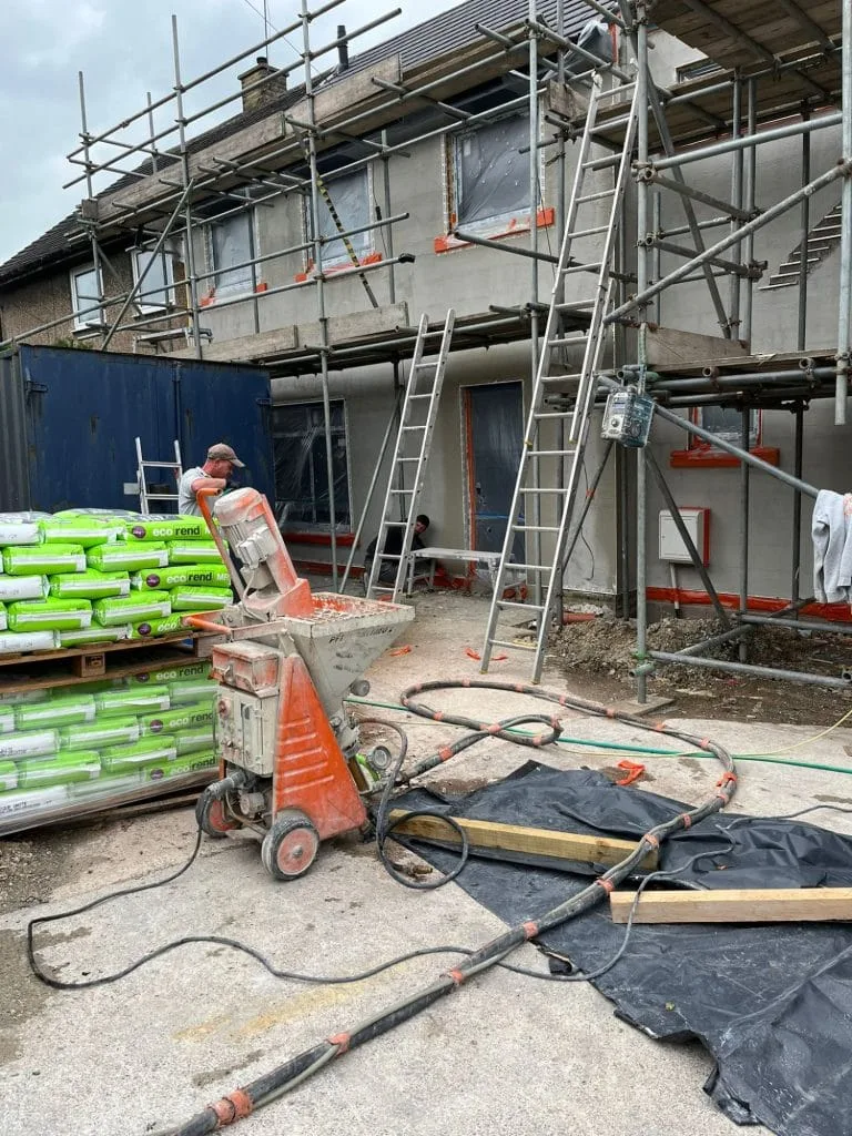 Ecorend rendering site spray machine scaffolding